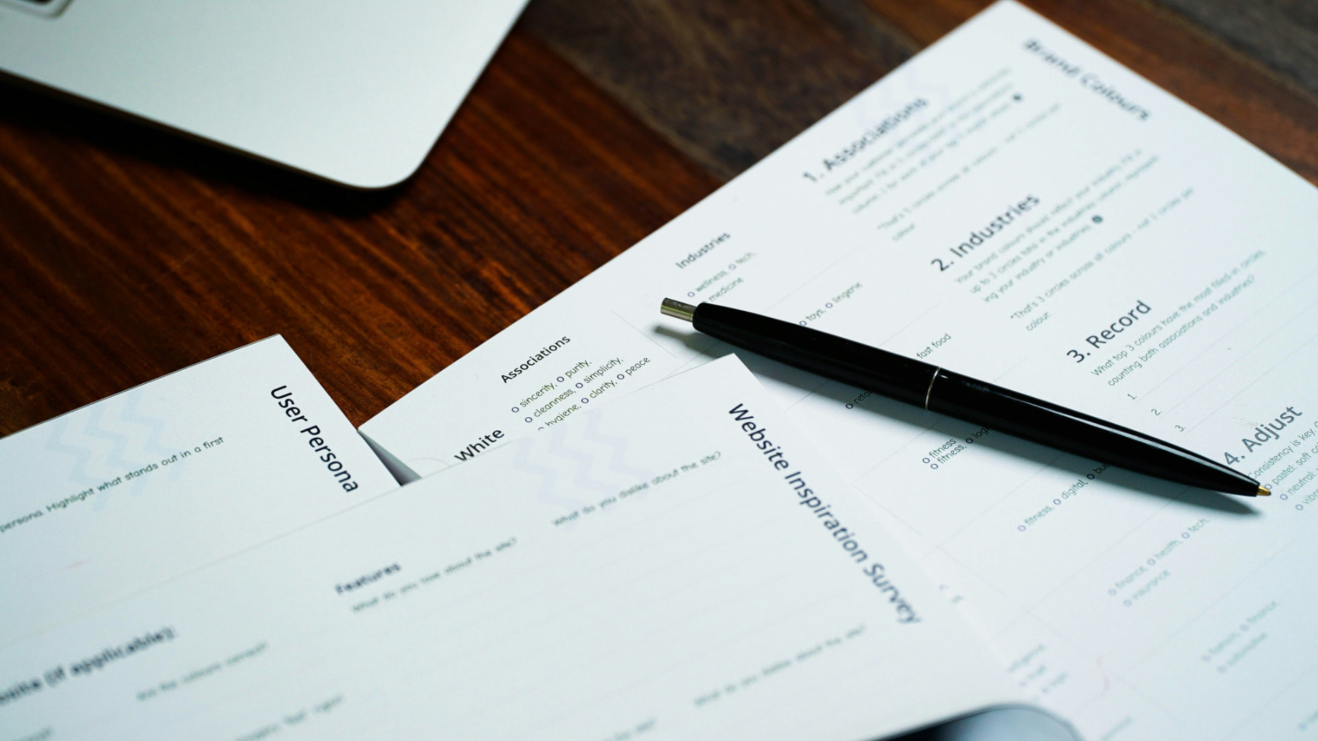 Blurred documents and a pen on a desk