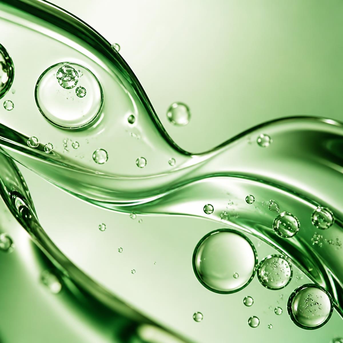 Macro view of translucent GHK-Cu serum droplets and glass-like liquid ribbons